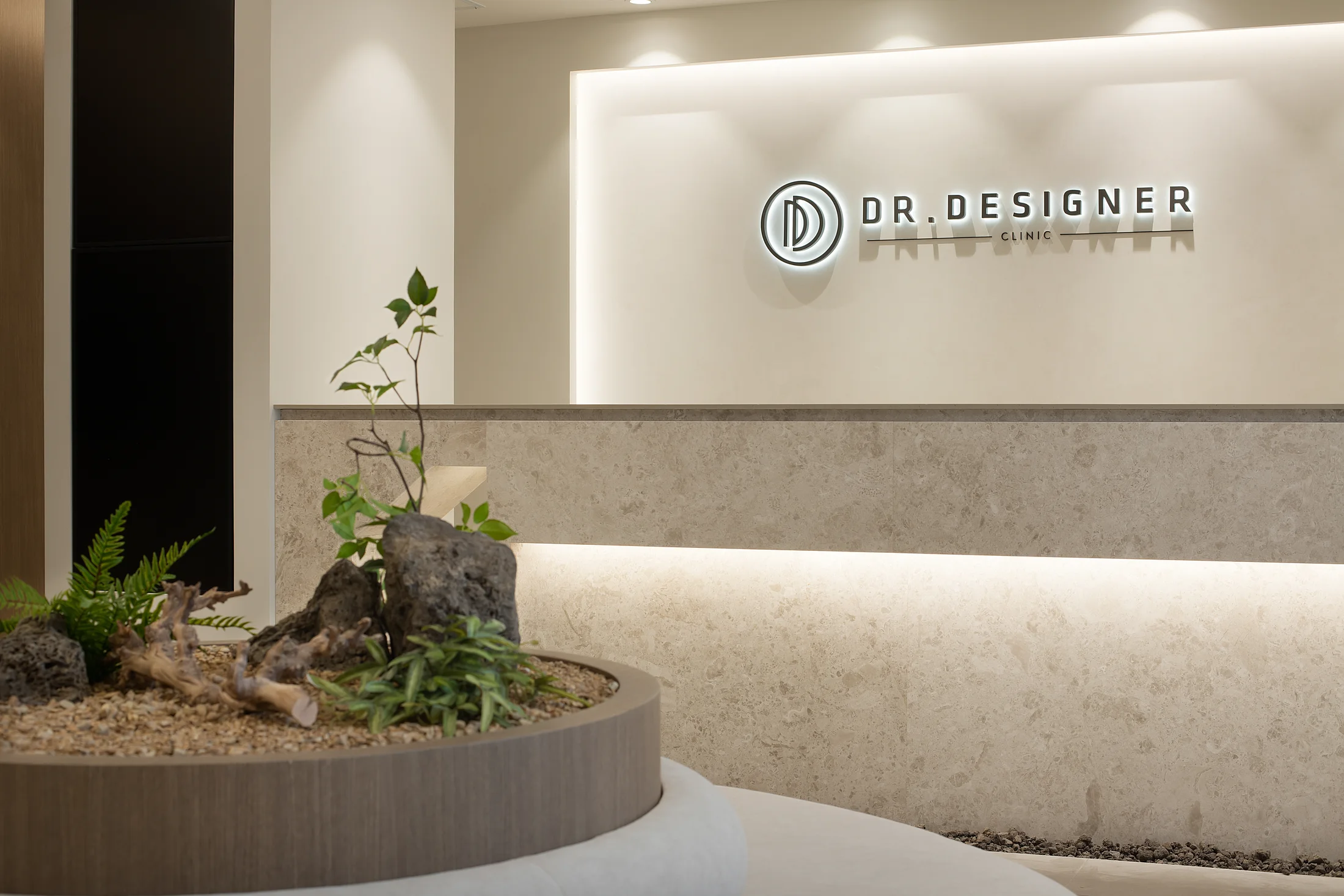 Reception desk and signature indoor garden at Dr. Designer Myeongdong